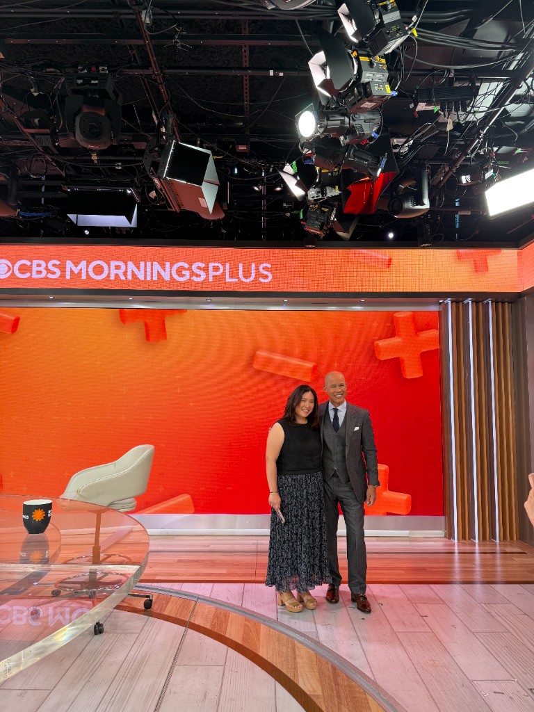 Stephanie Wu and Dominique Ansel standing in front of the CBS Mornings Plus backdrop