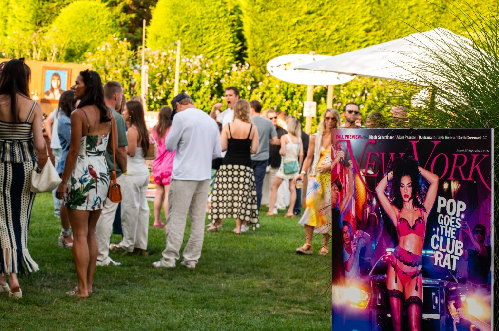 Guests at the Endless Summer Party with a New York Magazine cover display