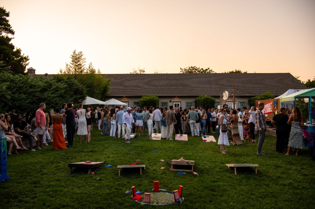 Wide view of guests on the lawn at Sole East during New York Magazine's Endless Summer Party